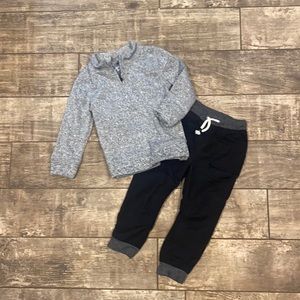 Fleece quarter zip sweater with lined black pant outfit